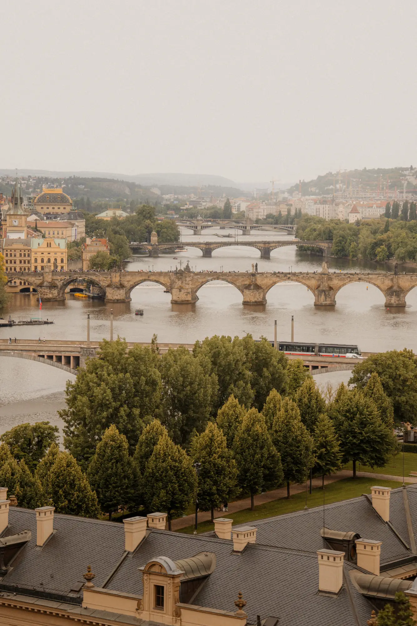 The bridges of the Vltava stacked in morning haze