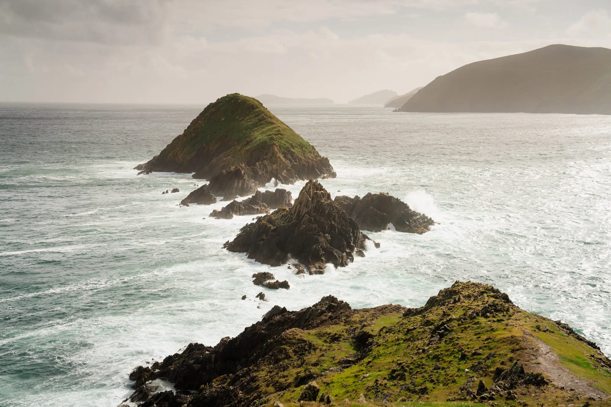 Sea stacks off Dunmore Head in heavy, shifting light