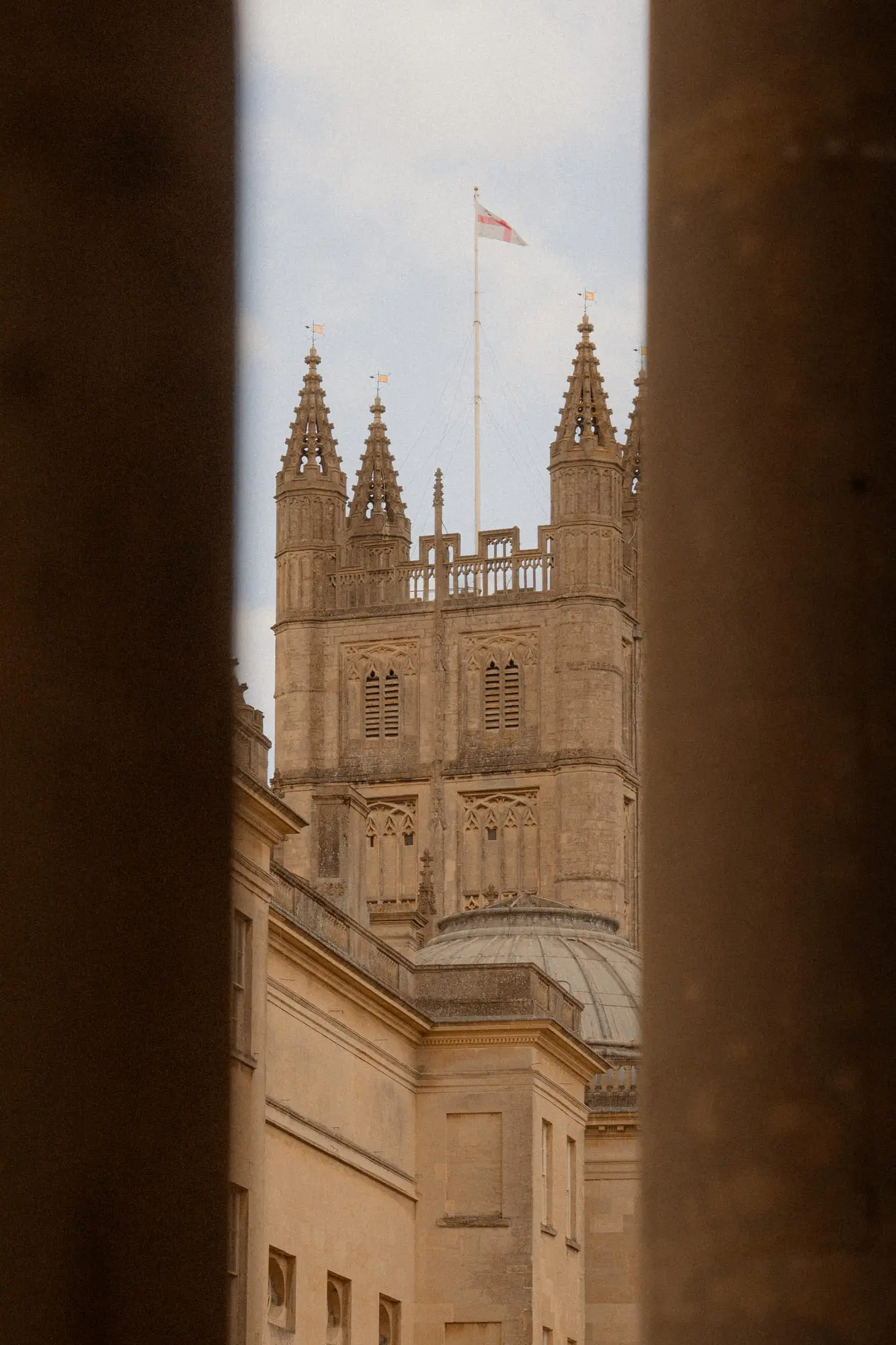 Bath Abbey's pinnacled towers framed between two columns