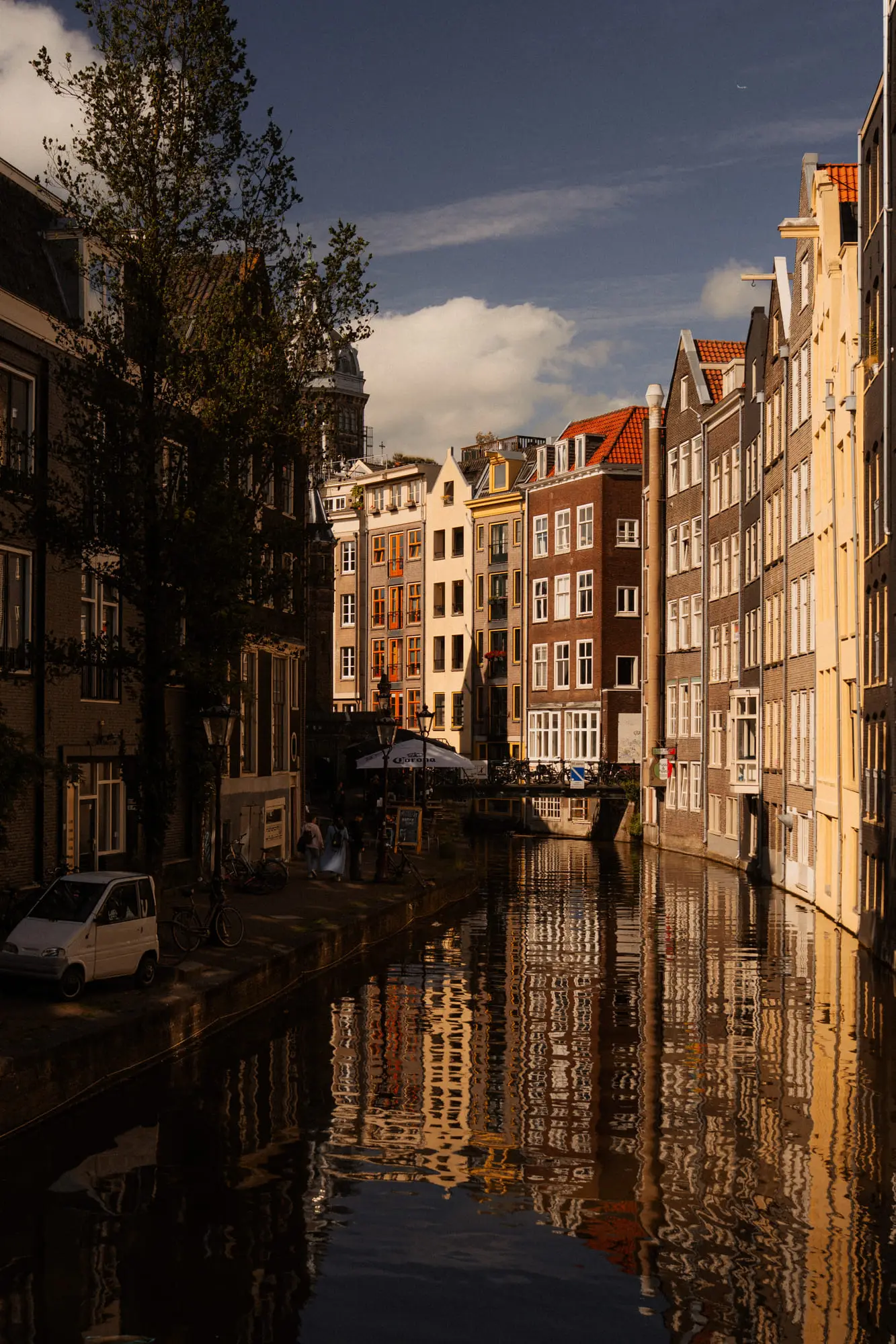 Golden-hour reflections down a quiet Amsterdam canal