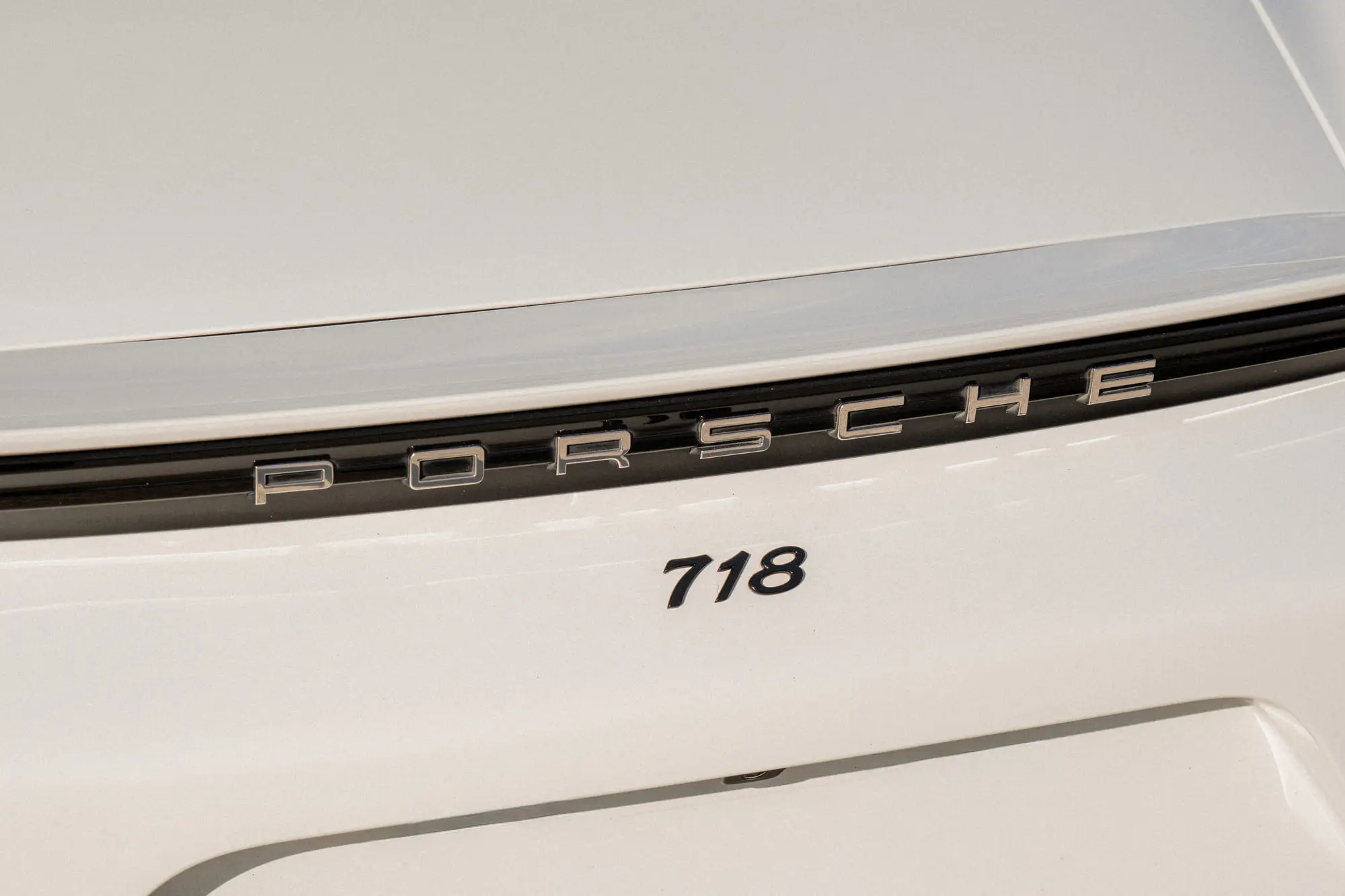 The 718 badge and ducktail spoiler in soft light