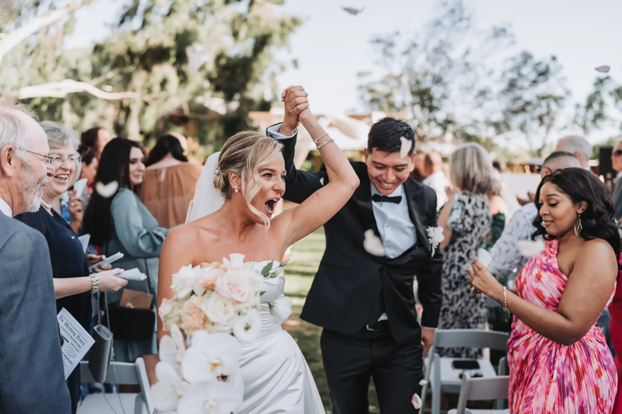 The bouquet thrown up as the couple walk out