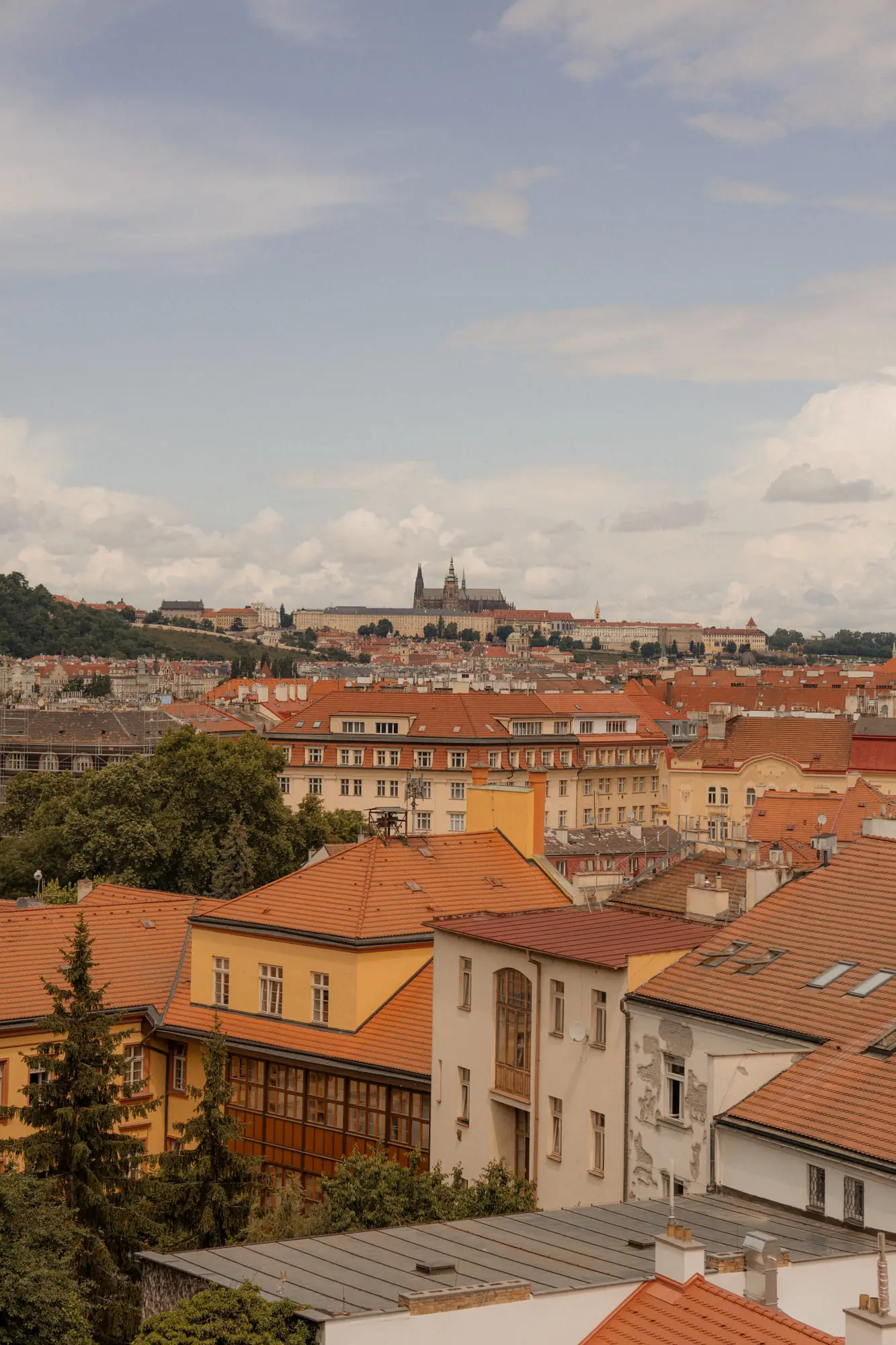 Rooftops and the castle beyond, a hazy Prague afternoon