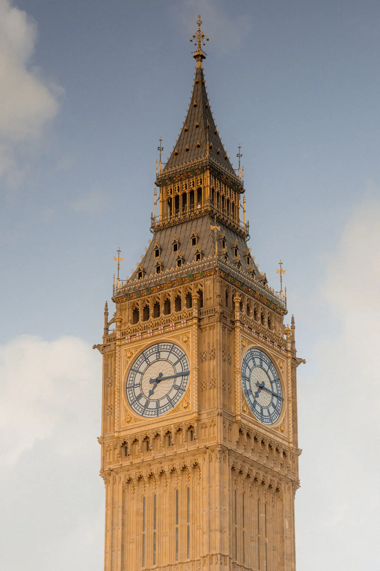 The clock face of Big Ben in golden evening light